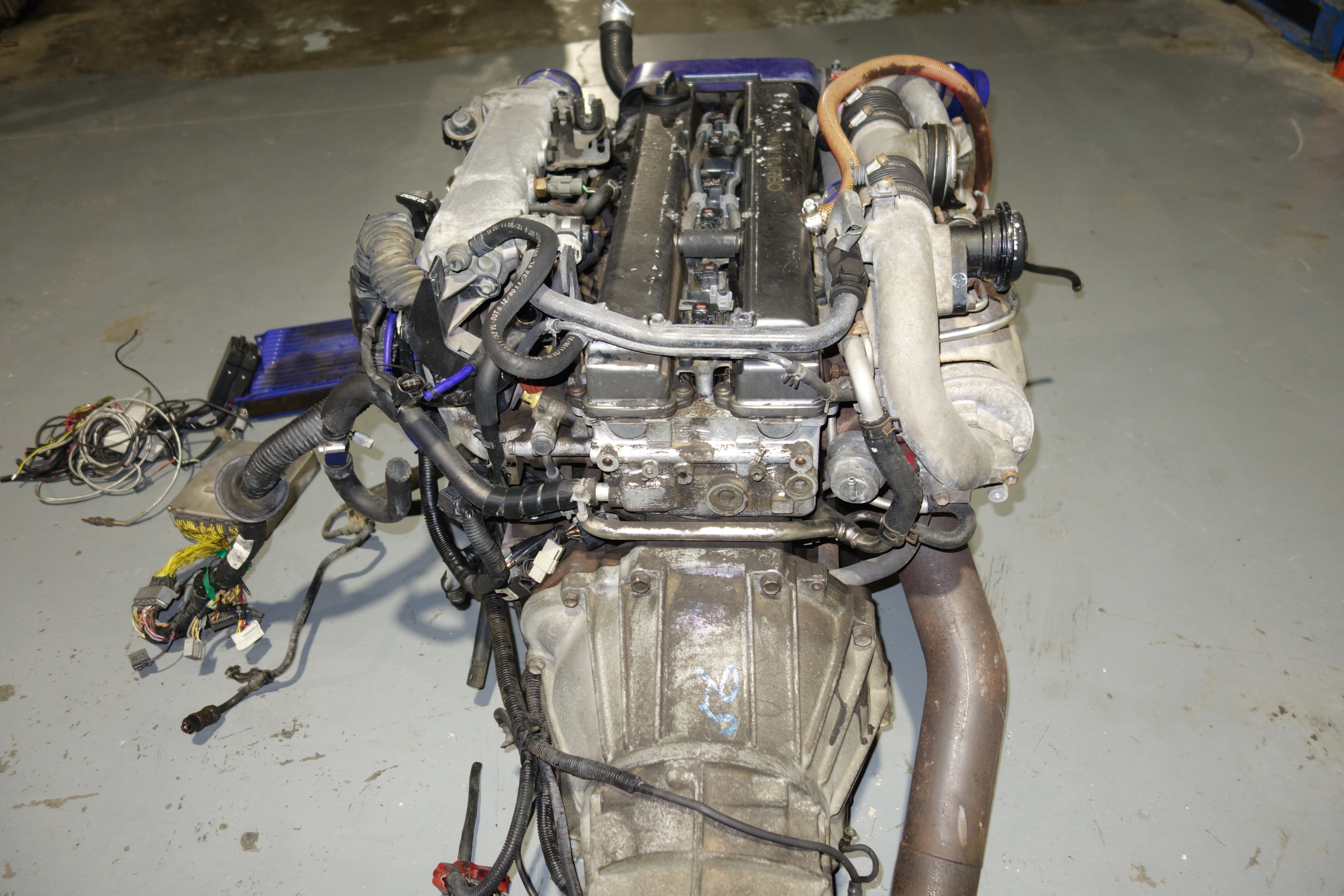 JDM Toyota Supra 1990-1993 1JZ-GTE Non-VVTi 2.5L Twin Turbo Engine & R154 5-Speed Manual Transmission Swap with Apexi Power FC ECU, Wiring Harness & Greddy Electronics