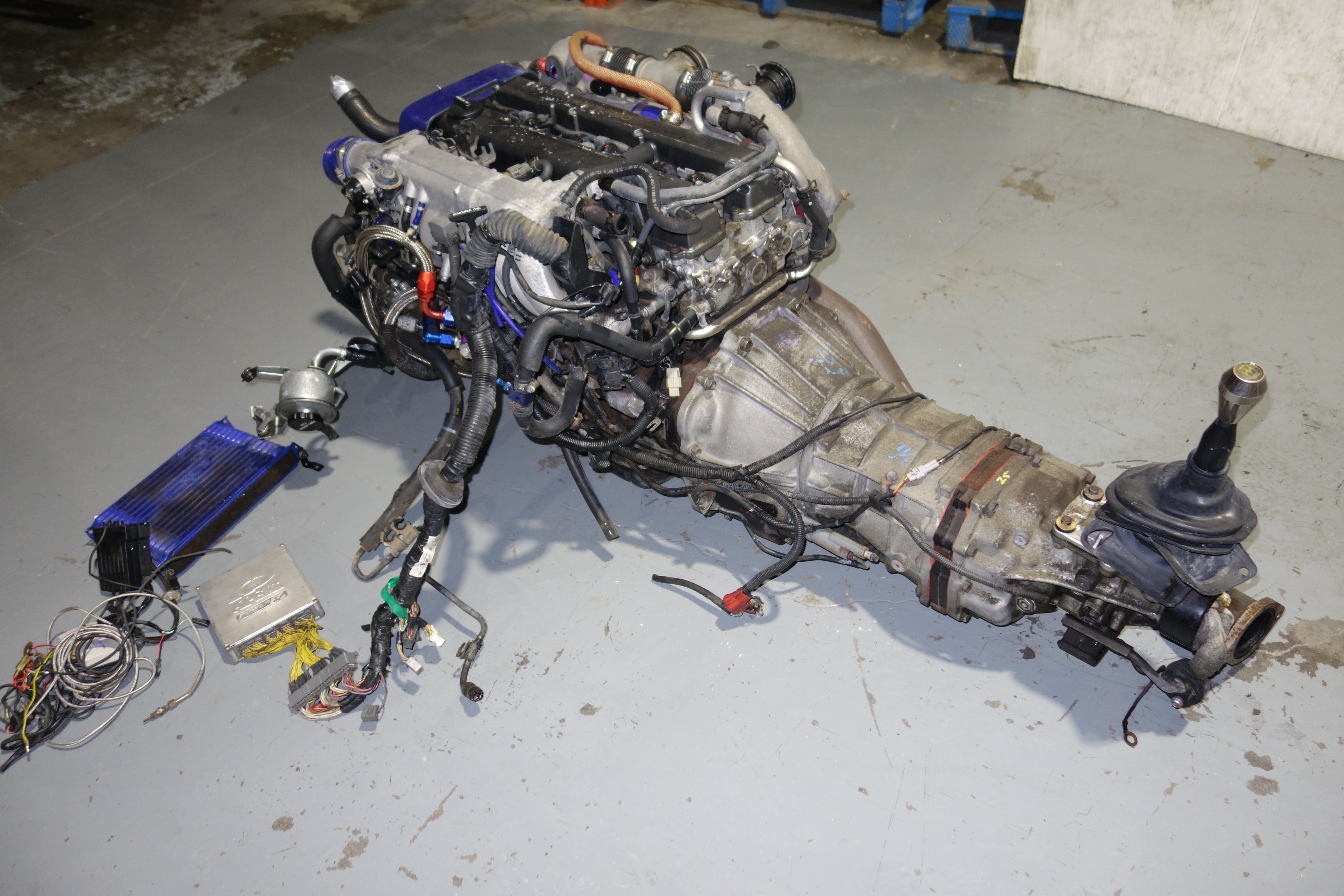 JDM Toyota Supra 1990-1993 1JZ-GTE Non-VVTi 2.5L Twin Turbo Engine & R154 5-Speed Manual Transmission Swap with Apexi Power FC ECU, Wiring Harness & Greddy Electronics
